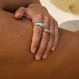 Elegant handmade MUSA rings on a hand, showcasing sustainable materials and ethical jewelry.