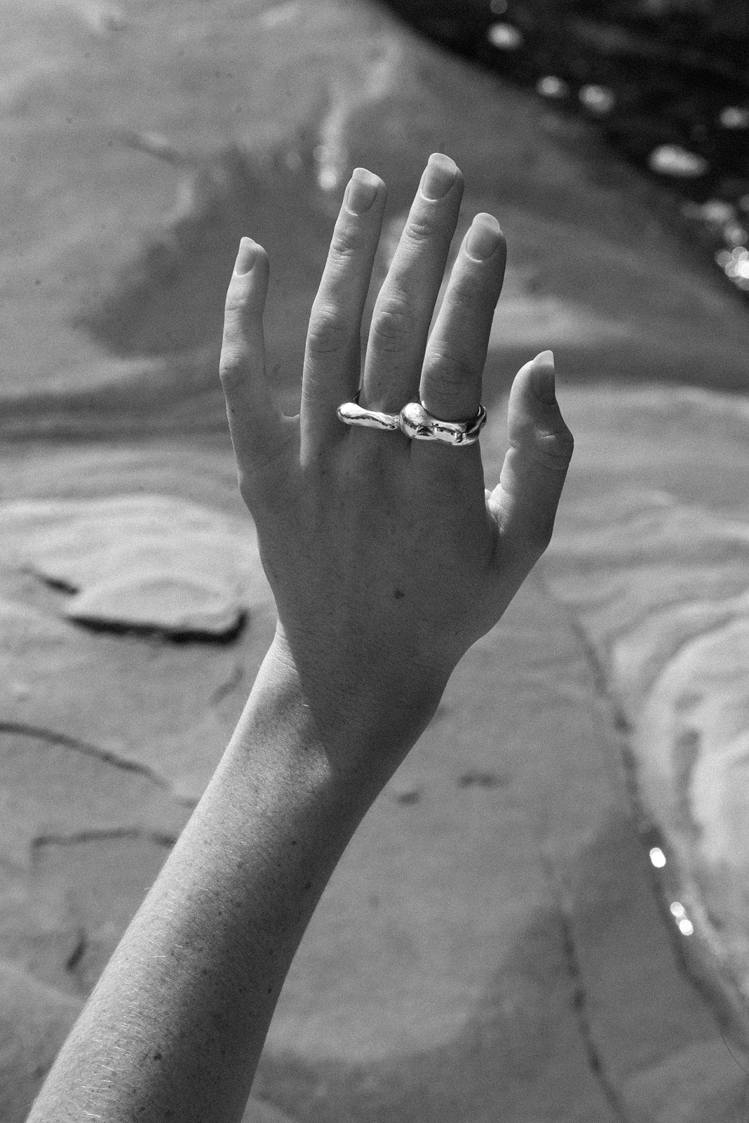 Hand displaying the MUSA ring, showcasing ethical, handmade jewelry in recycled silver.