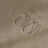 LOON big earrings in recycled silver, handmade ethical jewelry with a natural finish, showcasing sustainable craftsmanship.