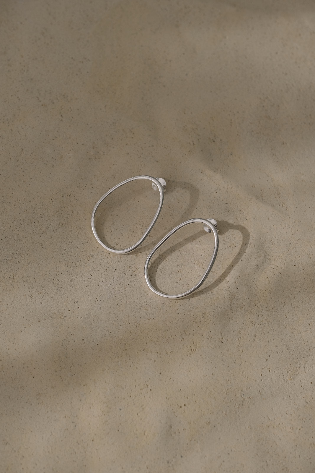 LOON big earrings in recycled silver, handmade ethical jewelry with a natural finish, showcasing sustainable craftsmanship.