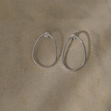 Handmade LOON big earrings in recycled silver with a natural finish. Ethical and sustainable jewelry design.