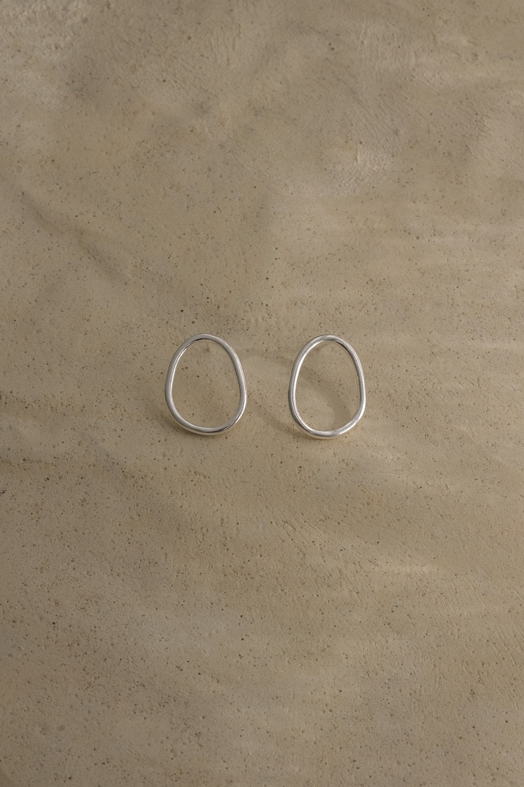 Handmade LOON small earrings in recycled silver, ethical and sustainable jewelry, featuring a natural semi-shiny surface.