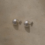 ONOA earrings made of recycled silver, showcasing ethical and sustainable handmade jewelry with a semi-matte finish.