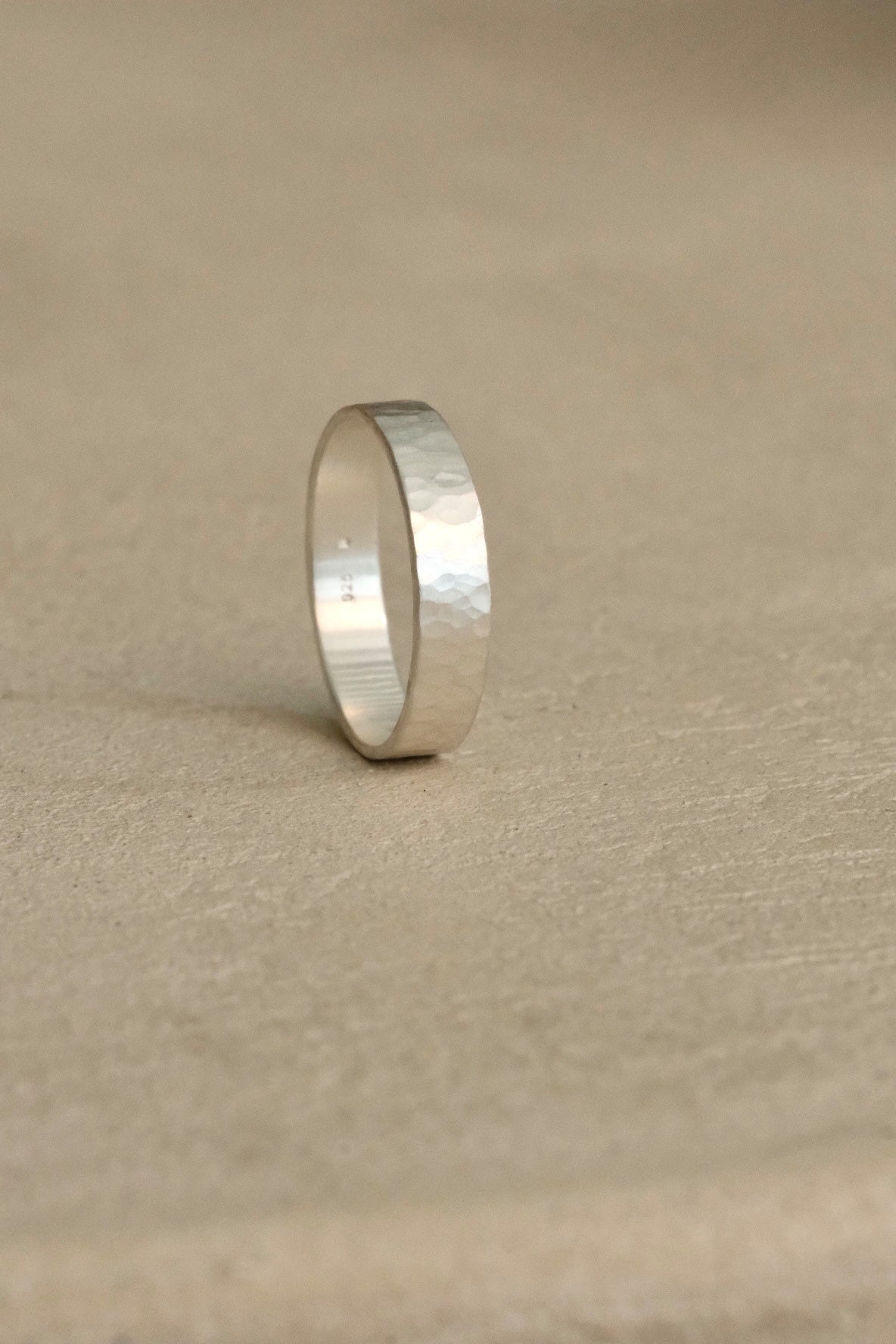Handmade ISIA big ring in recycled silver with a semi-matte surface and delicately hammered finish.
