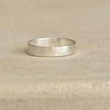 Handmade ISIA big ring in recycled silver with a semi-matte, delicately hammered surface.