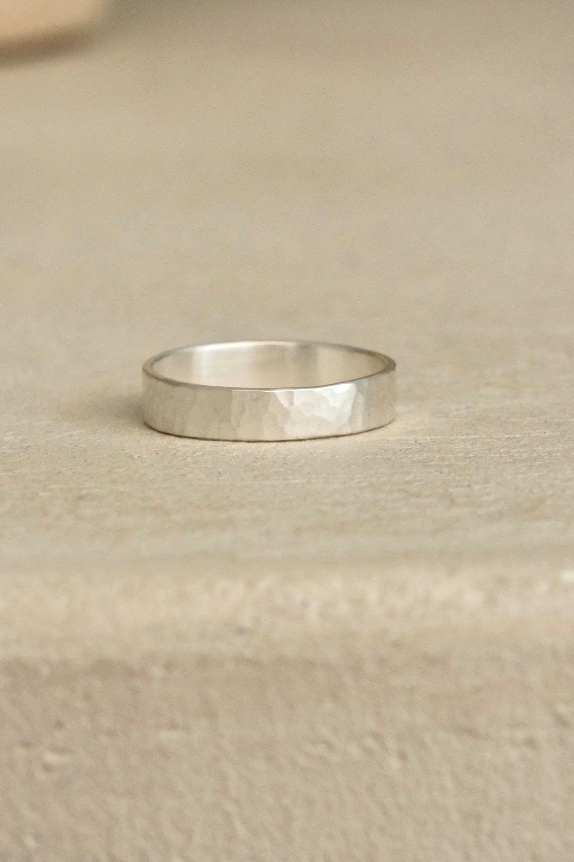 Handmade ISIA big ring in recycled silver with a semi-matte, delicately hammered surface.