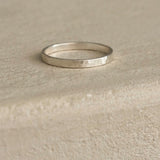 ISIA small ring in recycled silver with a semi-matte, delicately hammered surface, showcasing ethical and sustainable jewelry.