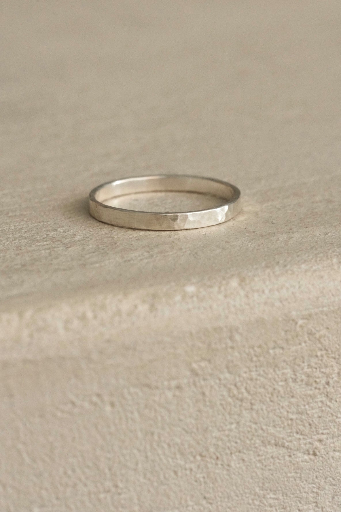 ISIA small ring in recycled silver with a semi-matte, delicately hammered surface, showcasing ethical and sustainable jewelry.