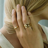 Model showcasing KAYU ring in 18k gold-plated recycled silver, highlighting handmade ethical jewelry.