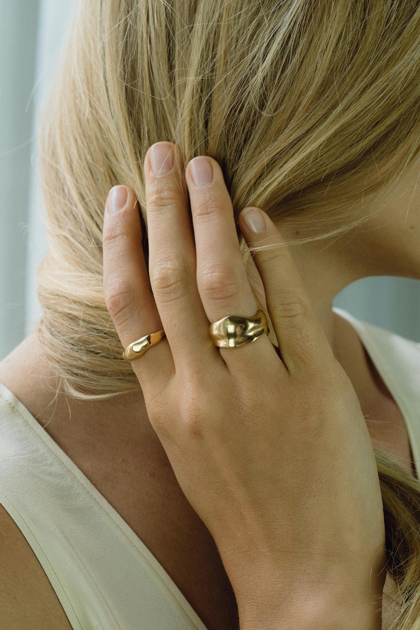 Model showcasing KAYU ring in 18k gold-plated recycled silver, highlighting handmade ethical jewelry.