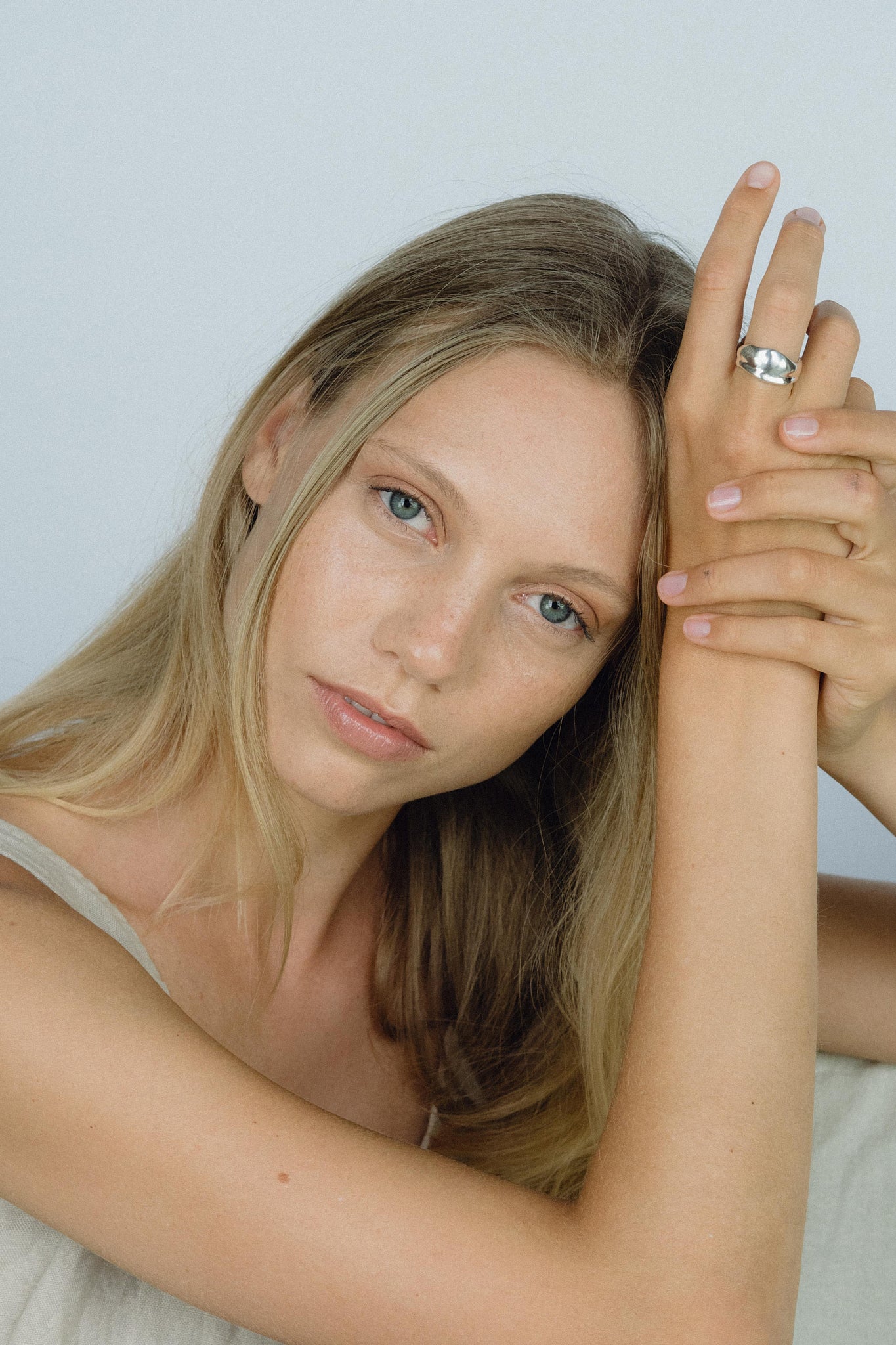 Model showcasing the KAYU ring made from ethical, handmade recycled silver and gold, emphasizing sustainable jewelry.