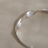 Handmade DROP 04 bracelet in 925 recycled silver, showcasing ethical and sustainable jewelry from Basel, Switzerland.