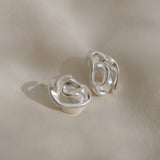 Handmade DROP 04 earrings in 925 recycled silver, featuring unique shapes and satin finish, ethically made in Basel.