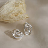 Handmade unique earrings in recycled silver with sustainable design from Basel, Switzerland.
