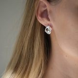 Handmade DROP 04 earrings in recycled silver, showcasing unique design and satin finish from Basel, Switzerland.