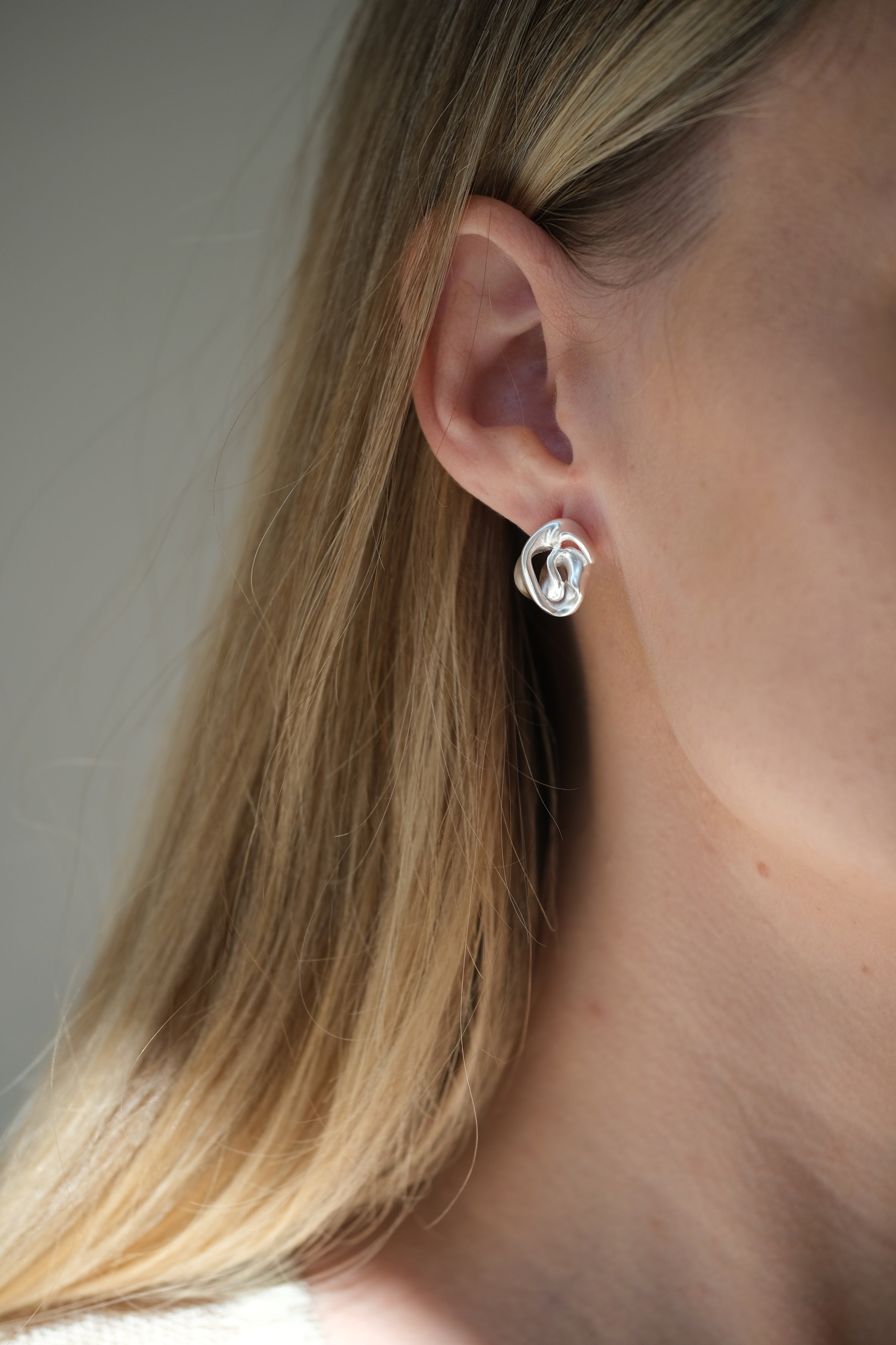 Handmade DROP 04 earrings in recycled silver, showcasing unique design and satin finish from Basel, Switzerland.
