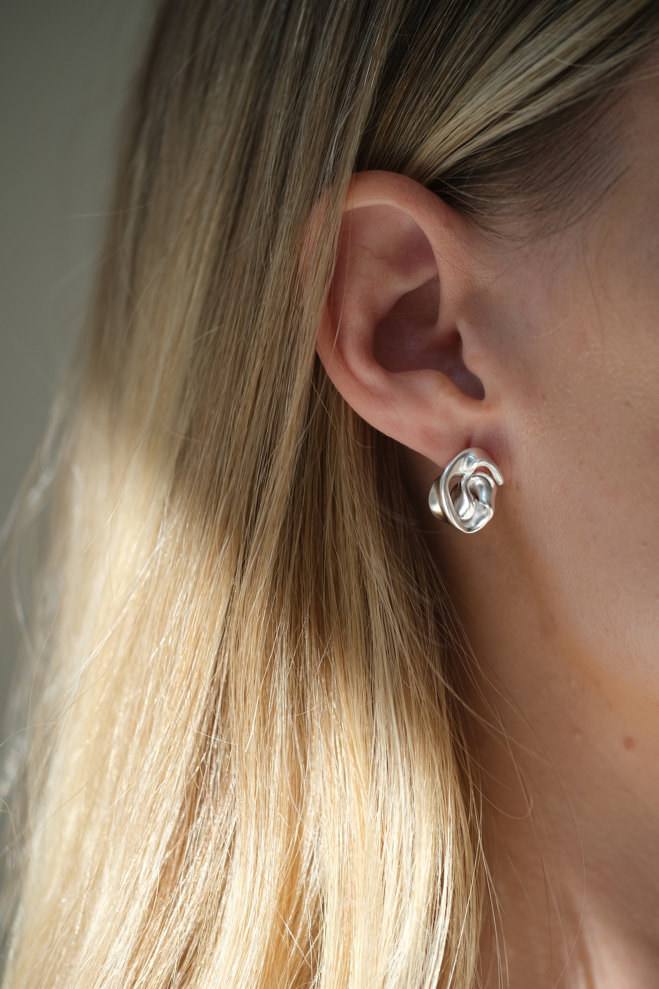 Handmade sustainable 925 recycled silver earrings showcasing unique design, created in Basel, Switzerland.