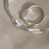 DROP 04 bracelet in recycled silver, handmade in Basel, unique ethical jewelry with subtle imperfections.