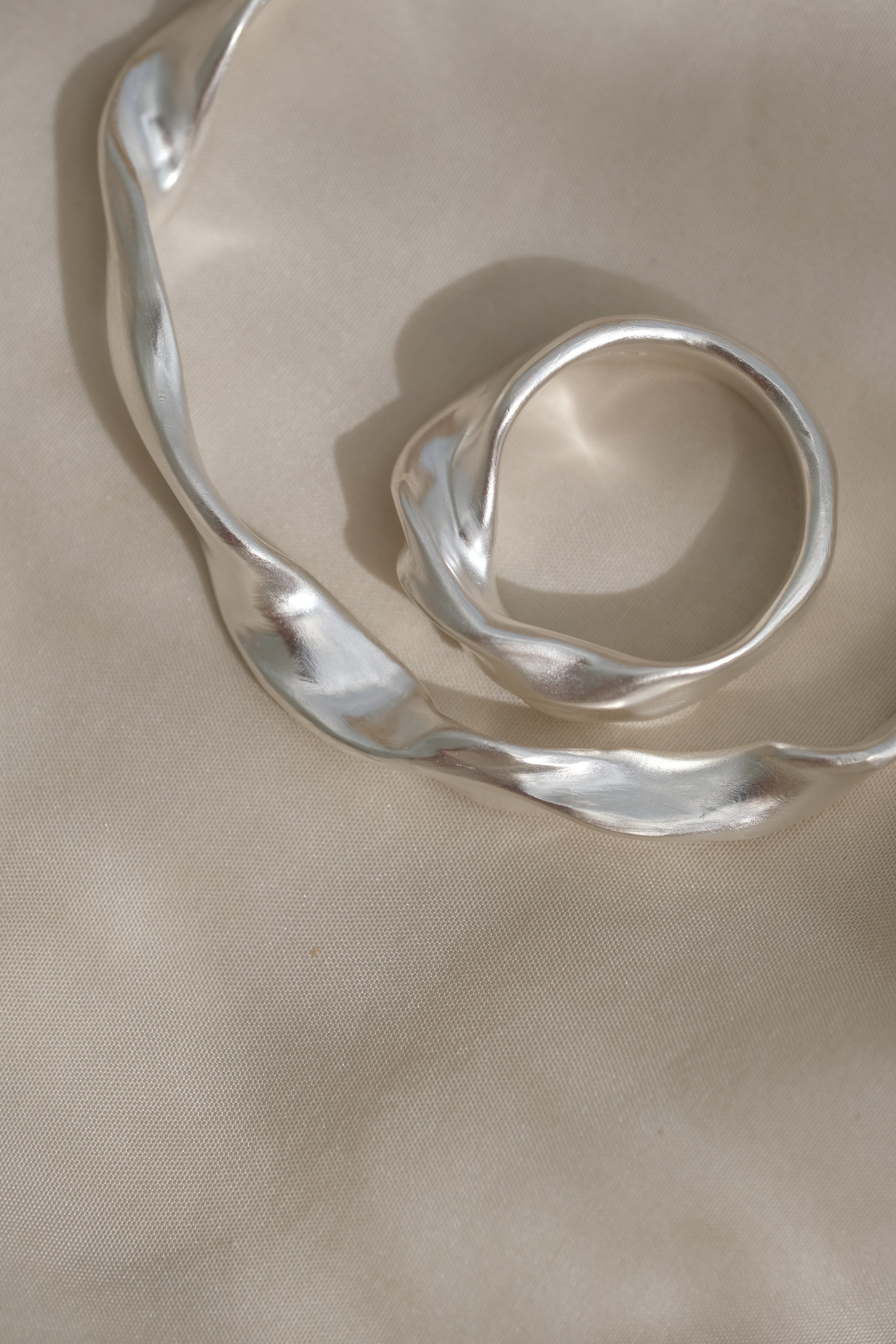 DROP 04 bracelet in recycled silver, handmade in Basel, unique ethical jewelry with subtle imperfections.