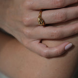 Hand model wearing DROP 04 ring, showcasing ethical and sustainable jewelry, handmade in Basel, Switzerland.