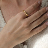 Elegant 18k gold-plated ring on hand, showcasing unique, ethical jewelry handmade in Basel, Switzerland.