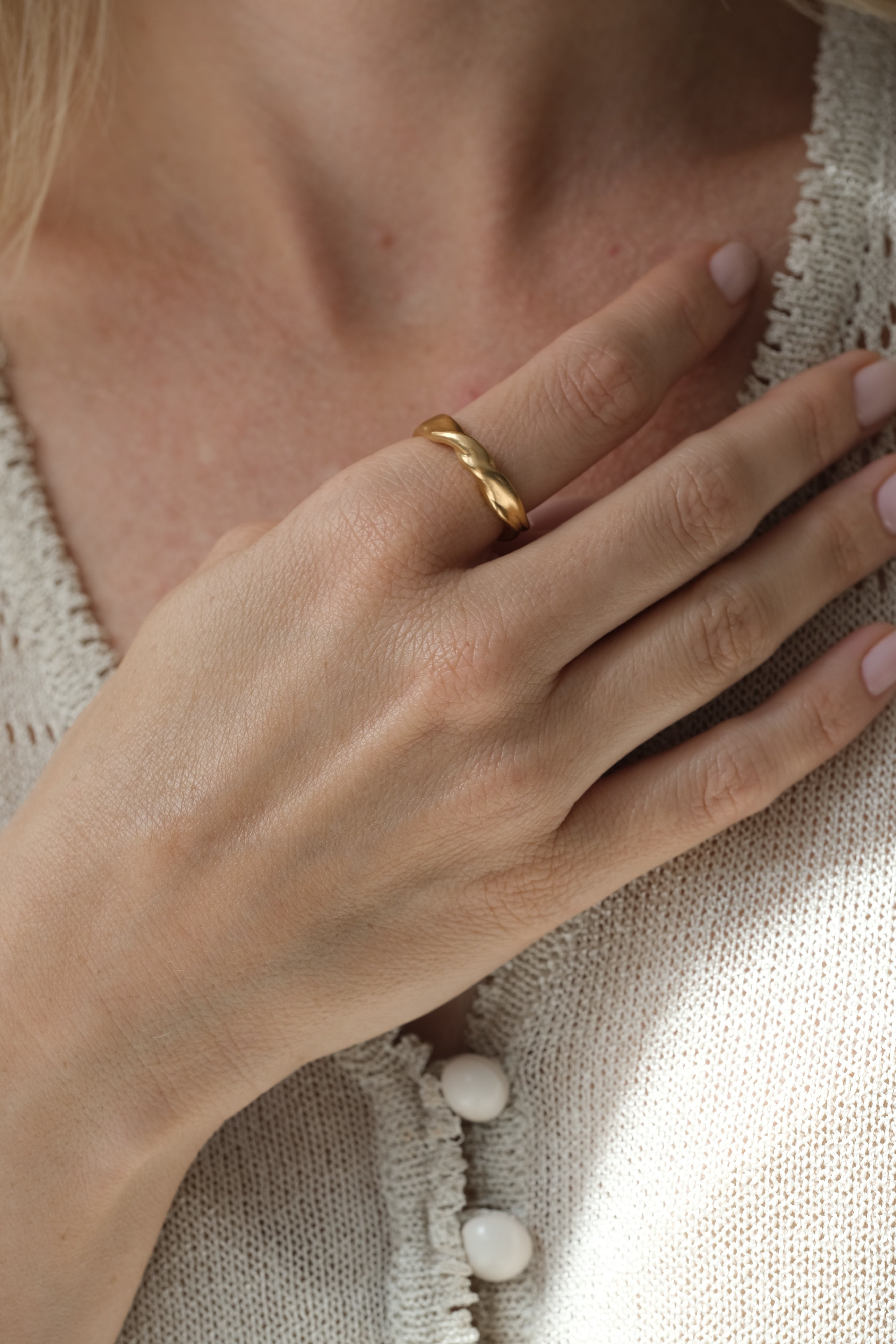 Elegant 18k gold-plated ring on hand, showcasing unique, ethical jewelry handmade in Basel, Switzerland.