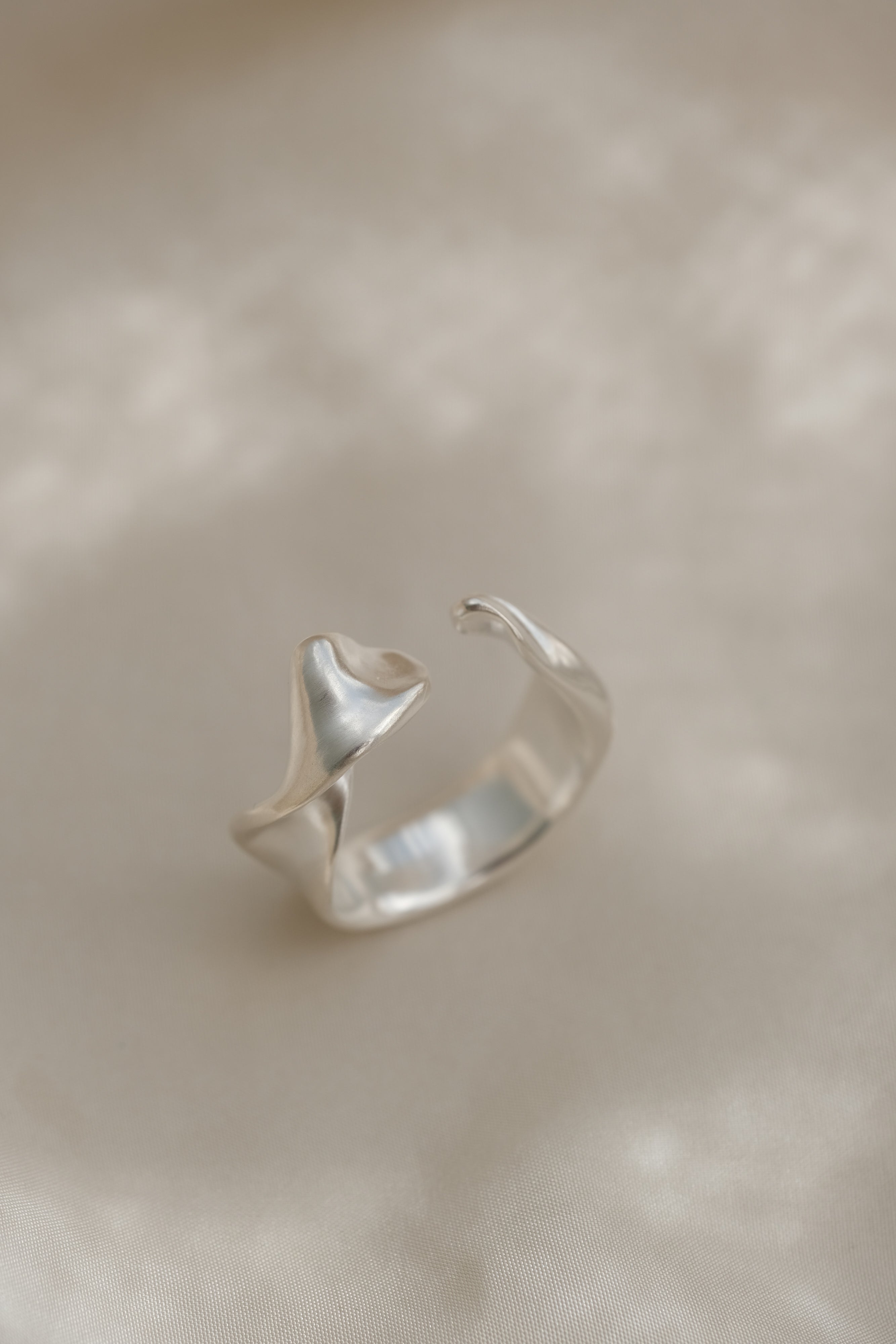 Handmade DROP 04 ring in 925 recycled silver, featuring a unique design and satin finish, crafted sustainably in Basel, Switzerland.