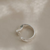 DROP 04 ring two in 925 recycled silver, handmade in Basel, Switzerland, featuring a unique design.
