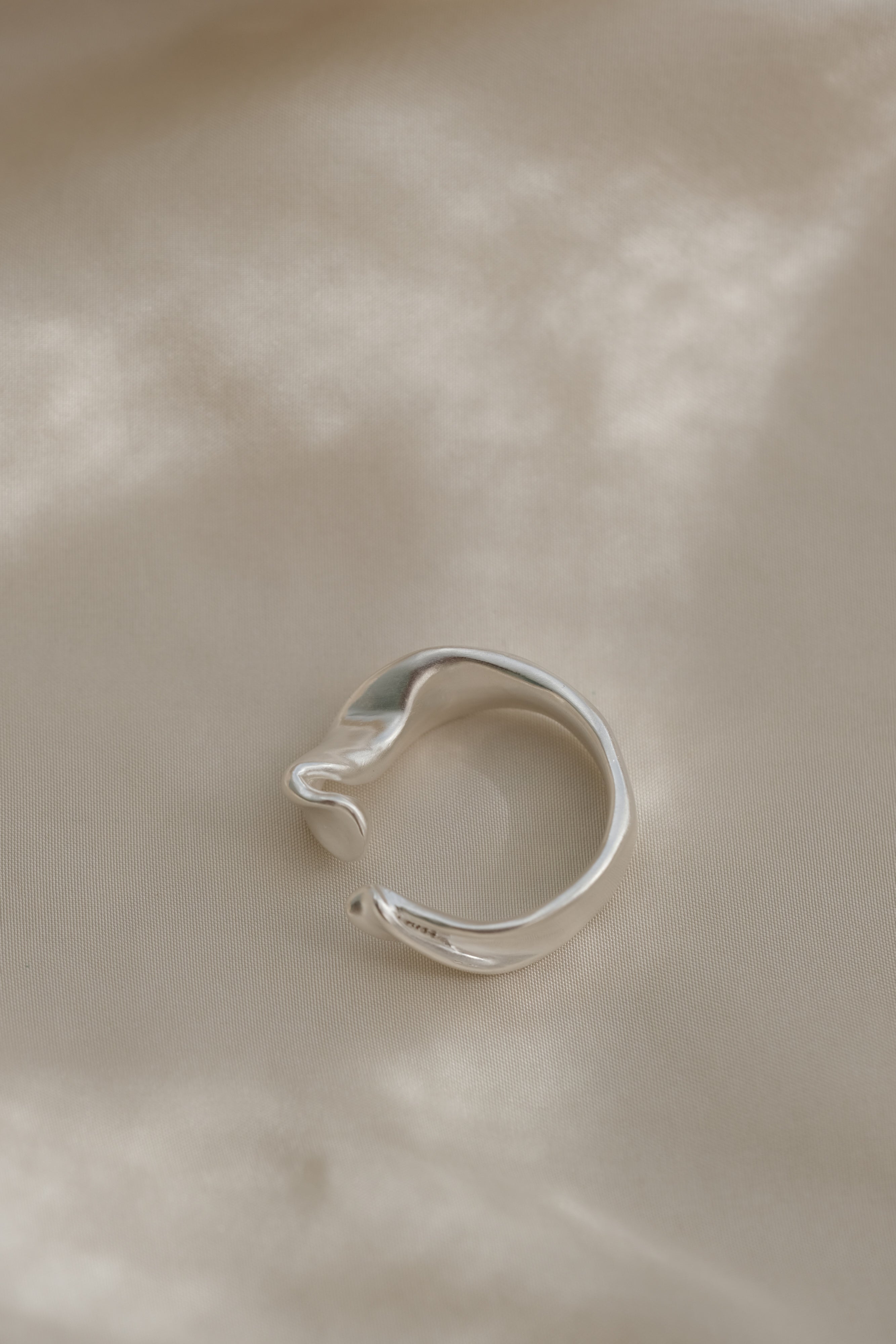 DROP 04 ring two in 925 recycled silver, handmade in Basel, Switzerland, featuring a unique design.