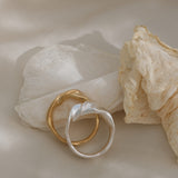 Handmade unique rings in recycled silver and gold, showcasing ethical jewelry design from Basel, Switzerland.