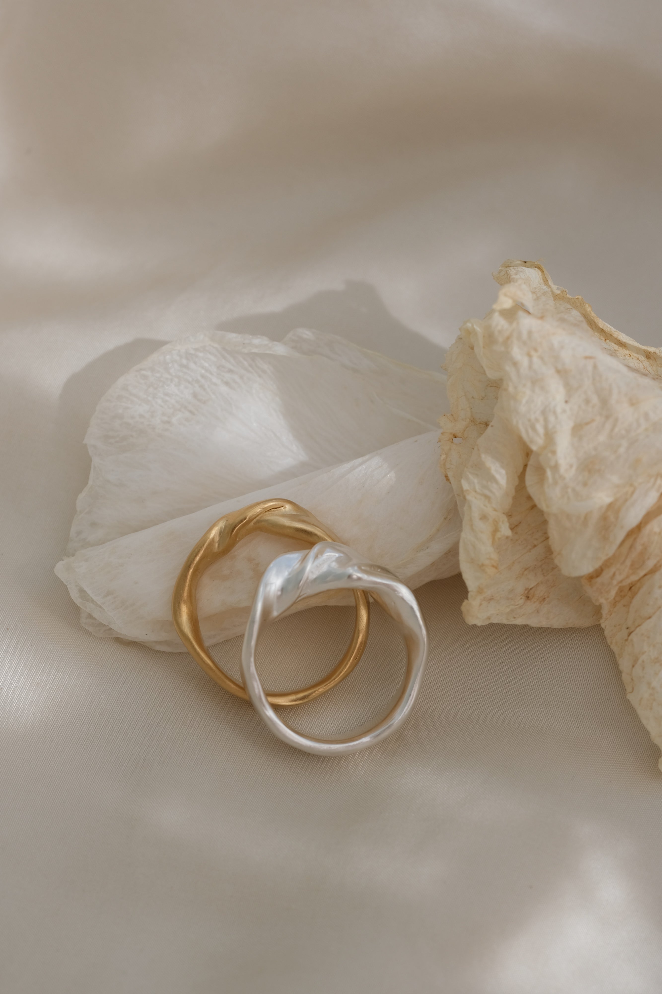 Handmade unique rings in recycled silver and gold, showcasing ethical jewelry design from Basel, Switzerland.