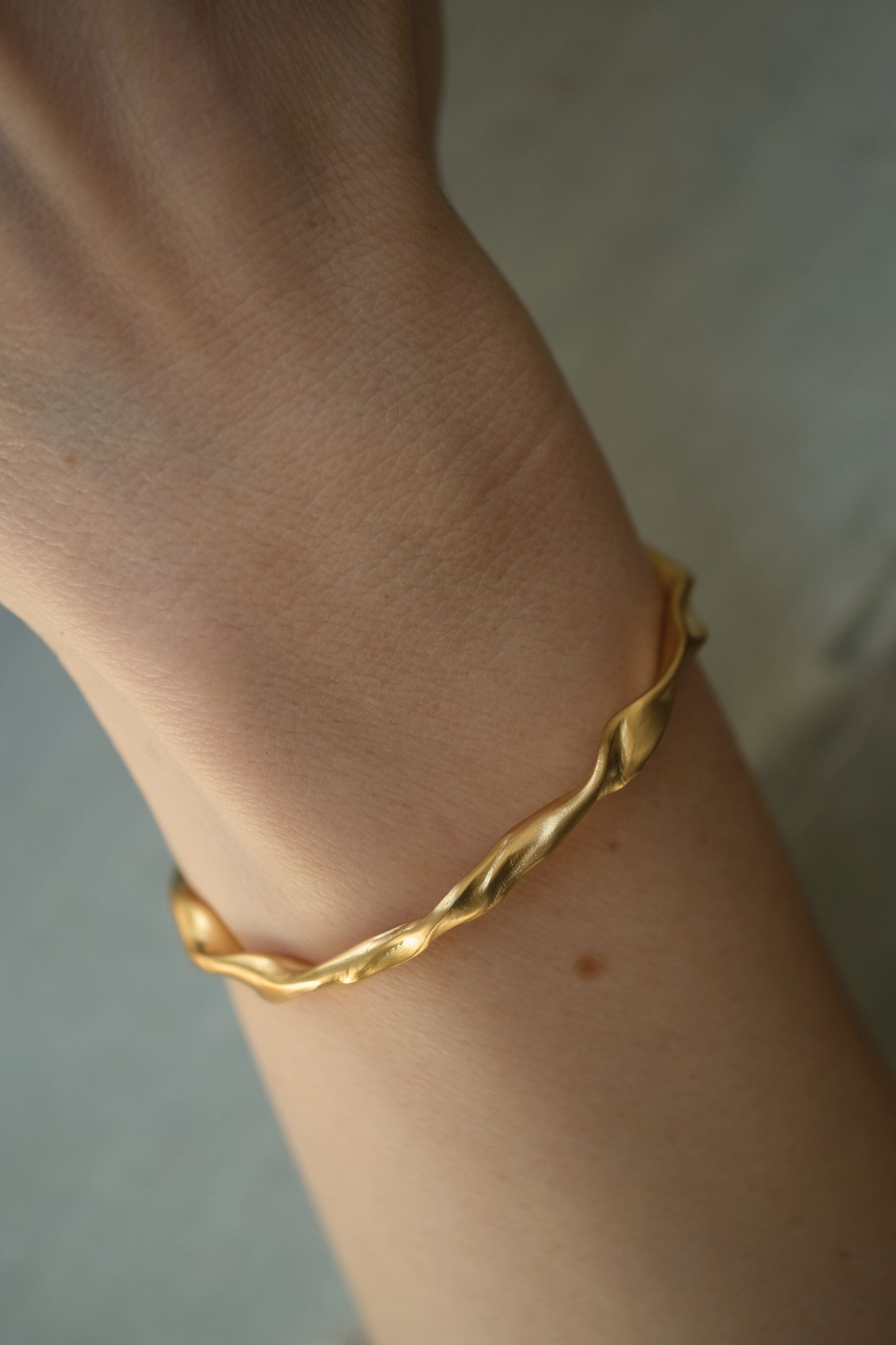 Handmade ethical bracelet, gold-plated on recycled silver, unique design from Basel, Switzerland.