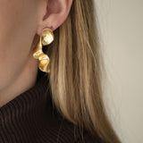 Unique DROP 01 earrings handmade in Basel, Switzerland, featuring ethical 18k gold-plated recycled silver.