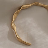 Handmade 18k gold-plated bracelet on recycled silver, showcasing unique design and sustainable craftsmanship.