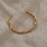 Handmade gold-plated bracelet, ethically crafted in Basel, Switzerland, showcasing unique design and sustainable materials.