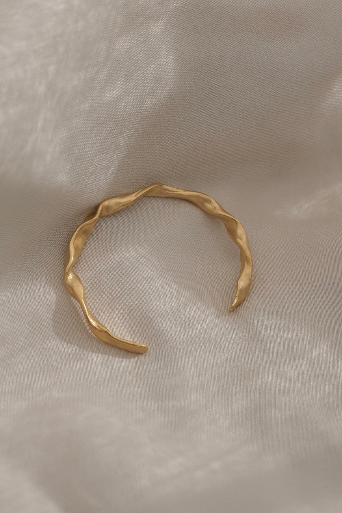 DROP 01 bracelet in 18k gold-plated recycled silver, handmade in Basel, unique ethical and sustainable jewelry piece.