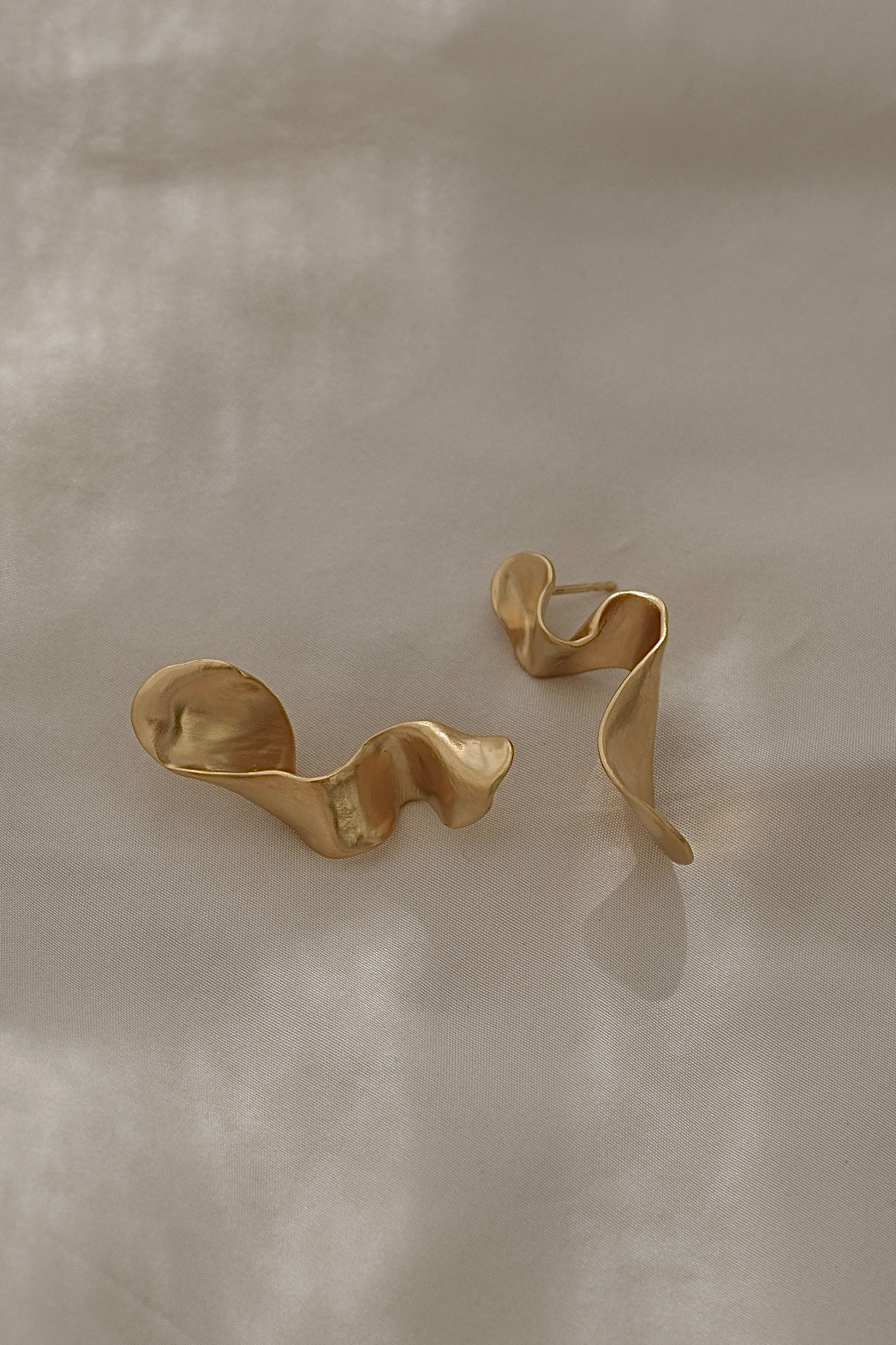 DROP 01 earrings, handmade in Basel Switzerland, crafted from 18k gold-plated recycled silver, unique sustainable jewelry.