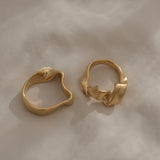 Two unique handmade rings in 18k gold plating, showcasing ethical and sustainable jewelry made in Basel, Switzerland.