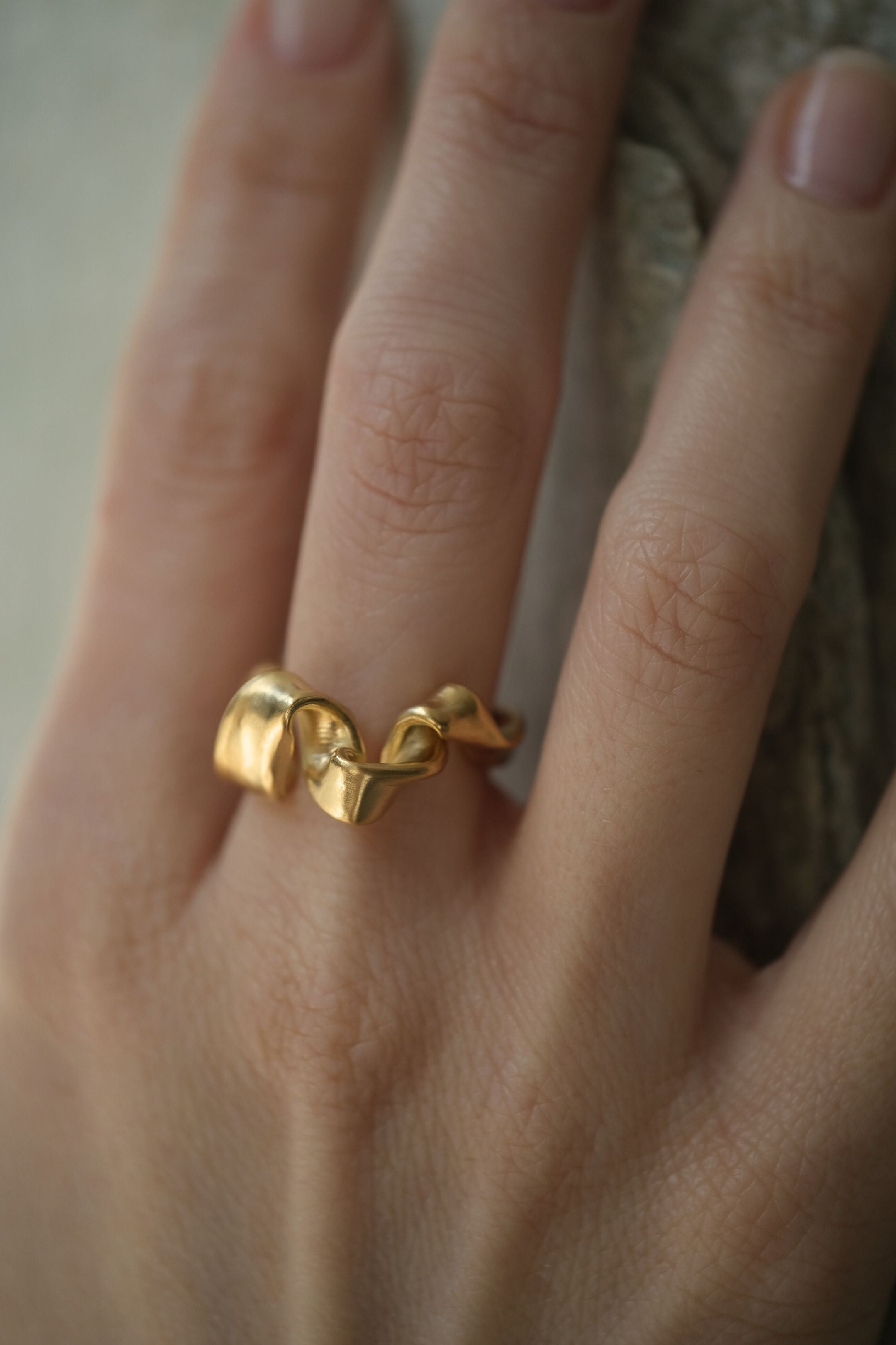 Handmade DROP 01 ring in 18k gold-plated on recycled silver, showcasing unique ethical jewelry crafted in Basel, Switzerland.