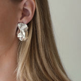 Handmade unique earrings in recycled silver, featuring an organic design, crafted sustainably in Basel, Switzerland.