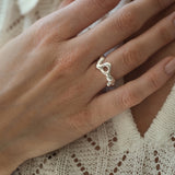 Handcrafted DROP 02 ring in recycled silver, showcasing unique design and sustainable materials in Basel, Switzerland.