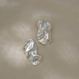 Handmade ethical earrings in recycled silver, featuring a satin finish, shaped in Basel, Switzerland.