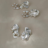 DROP 02 earrings in recycled silver, handmade in Basel, featuring unique satin finish and organic shapes, ethical jewelry.