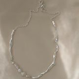Handmade necklace in 925 recycled silver with unique organic design and natural pearls, showcasing sustainable jewelry craftsmanship.