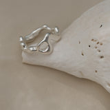 Handmade ring crafted from 925 recycled silver, showcasing unique design and polished finish, made in Basel, Switzerland.