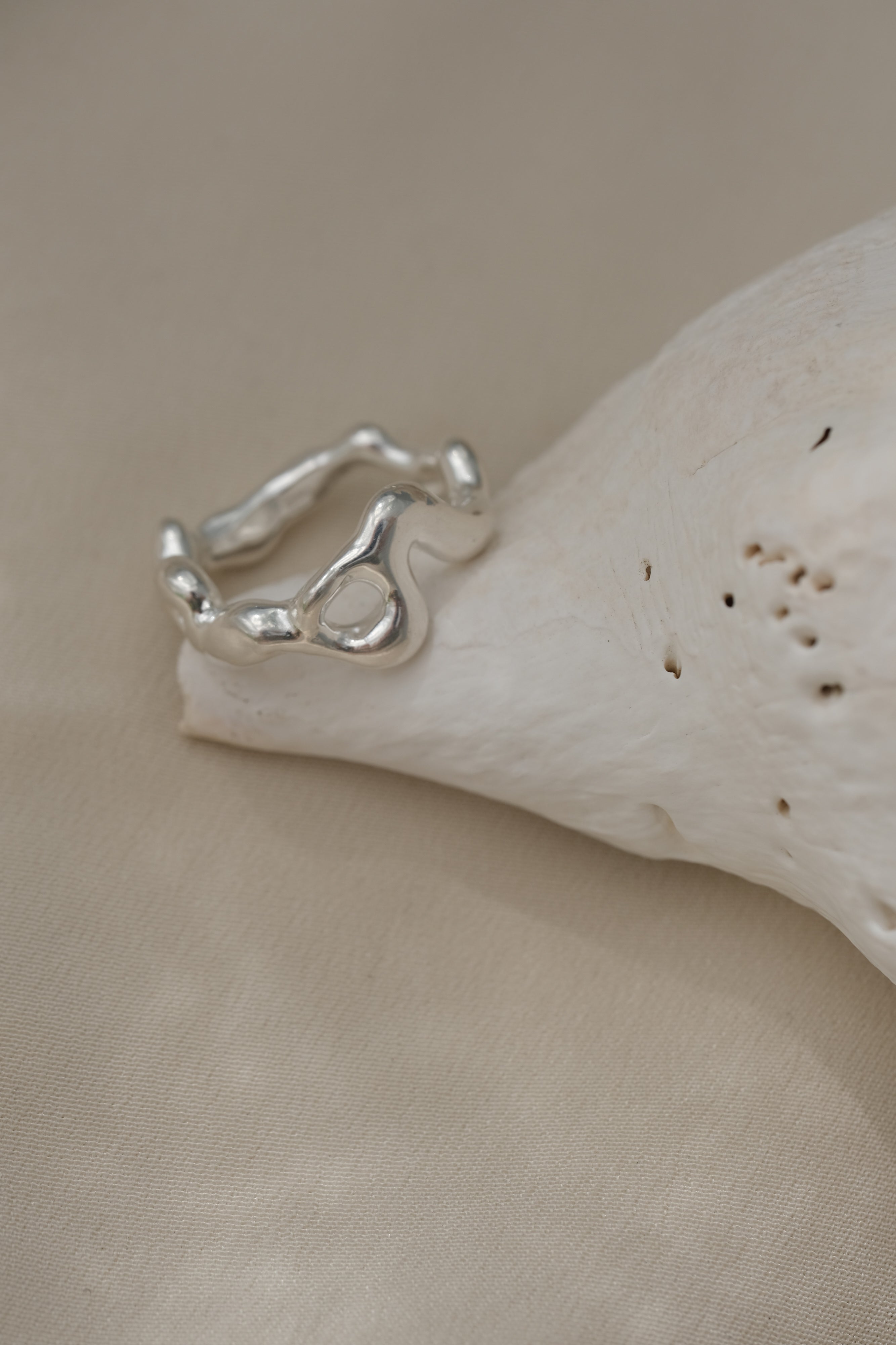 Handmade ring crafted from 925 recycled silver, showcasing unique design and polished finish, made in Basel, Switzerland.