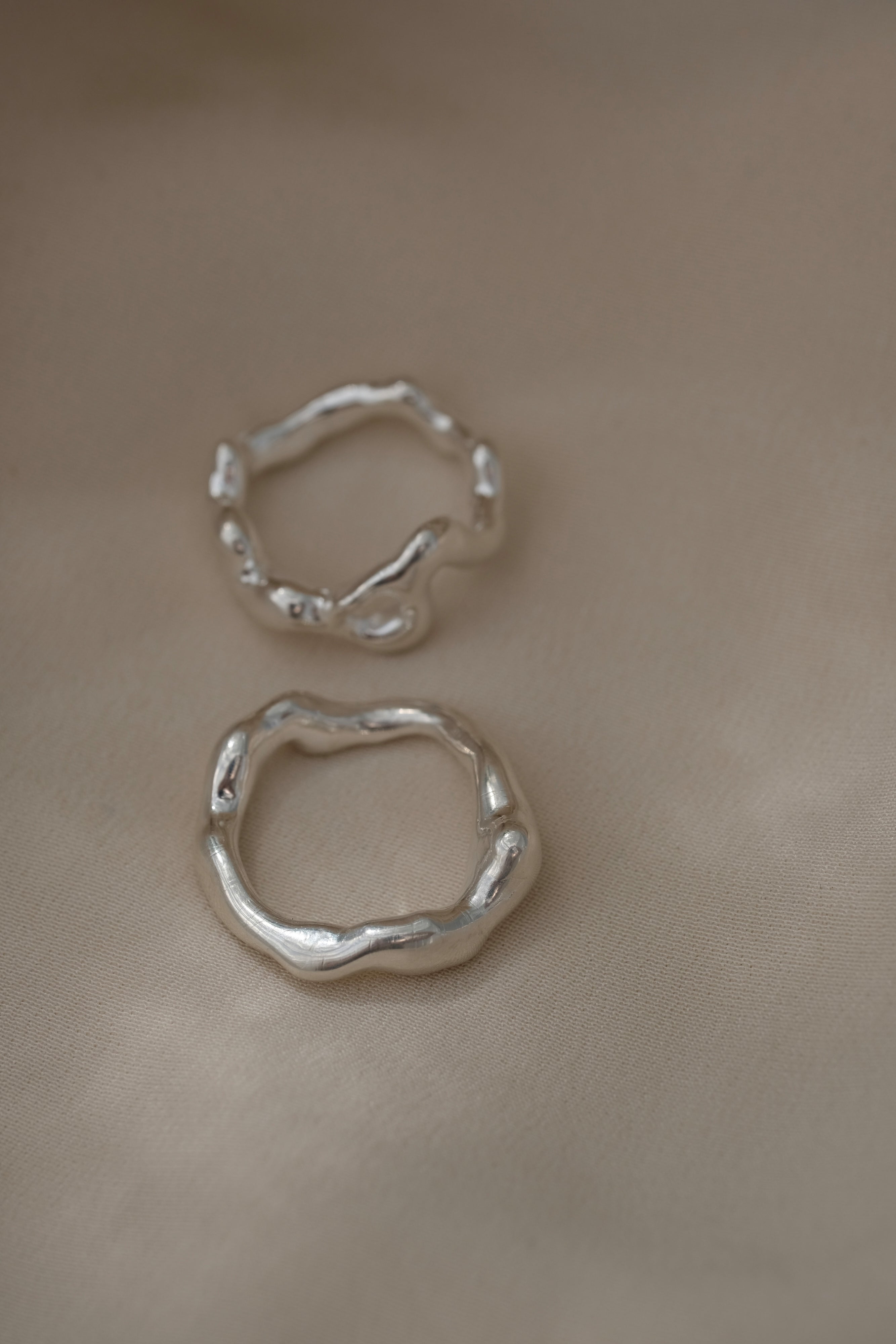 Handmade two-ring set in 925 recycled silver, featuring unique textures, crafted in Basel, Switzerland.