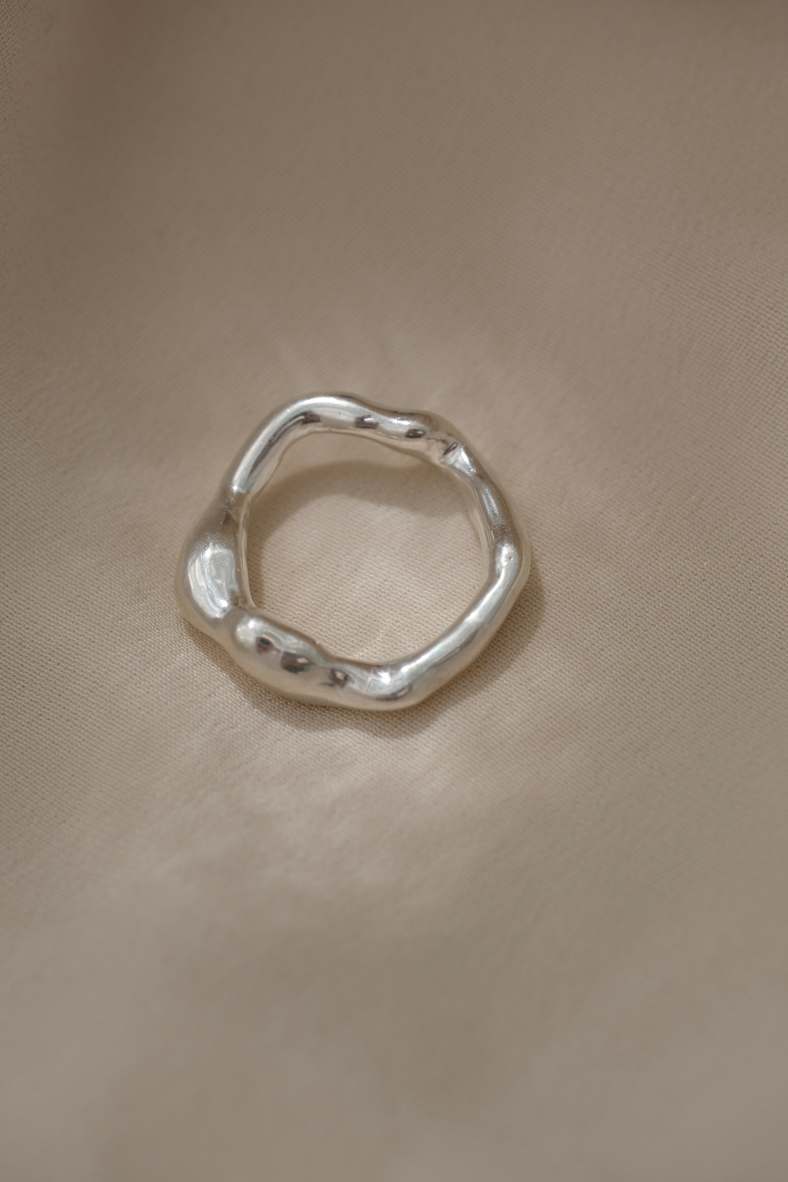 Handmade ring in recycled silver, featuring a unique organic shape, crafted in Basel, Switzerland.