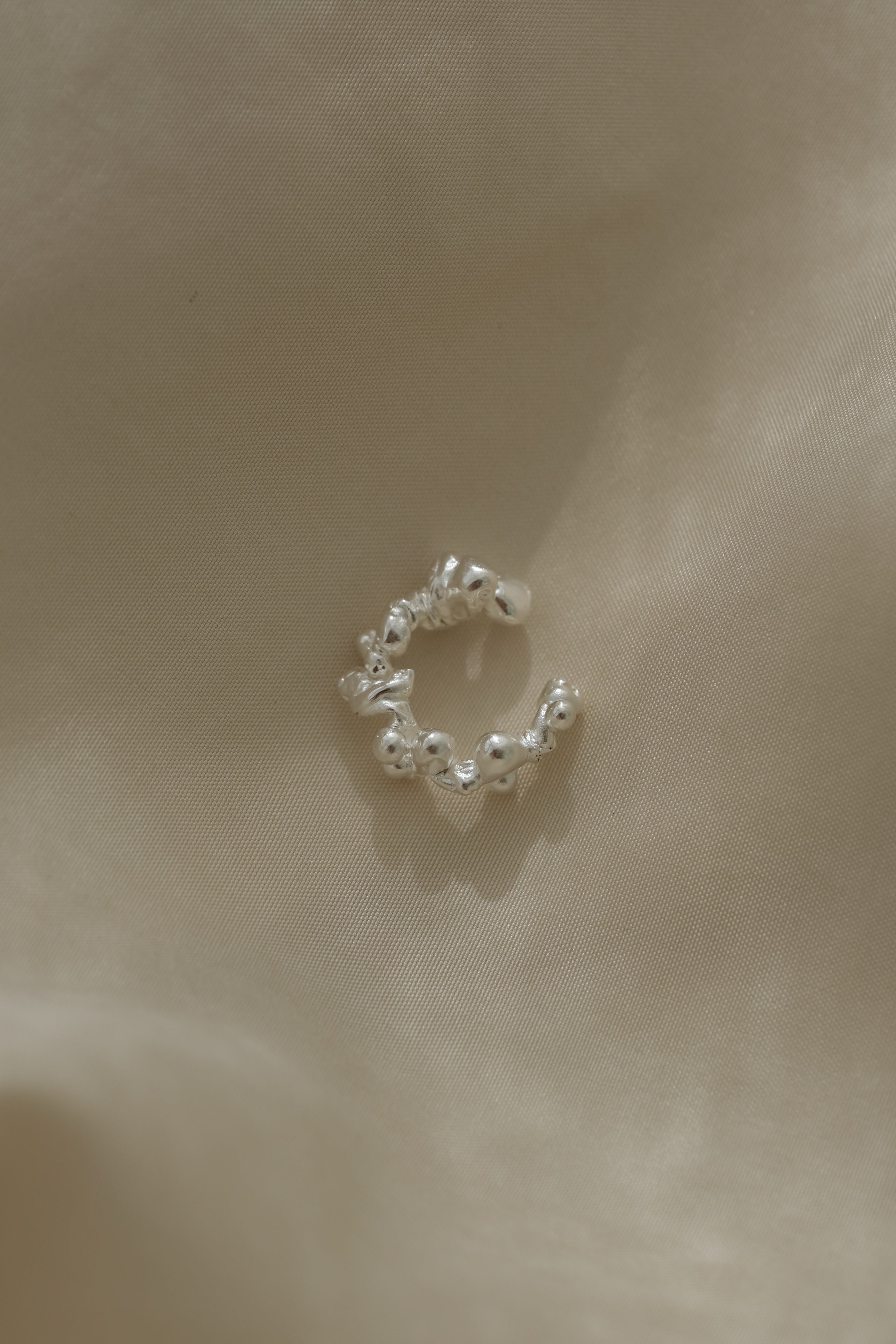 Handmade in Basel, Switzerland, this sustainable ear cuff showcases unique design and ethical materials.
