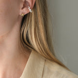 Handmade DROP 03 ear cuff in recycled silver, showcasing ethical and sustainable jewelry, crafted in Basel, Switzerland.